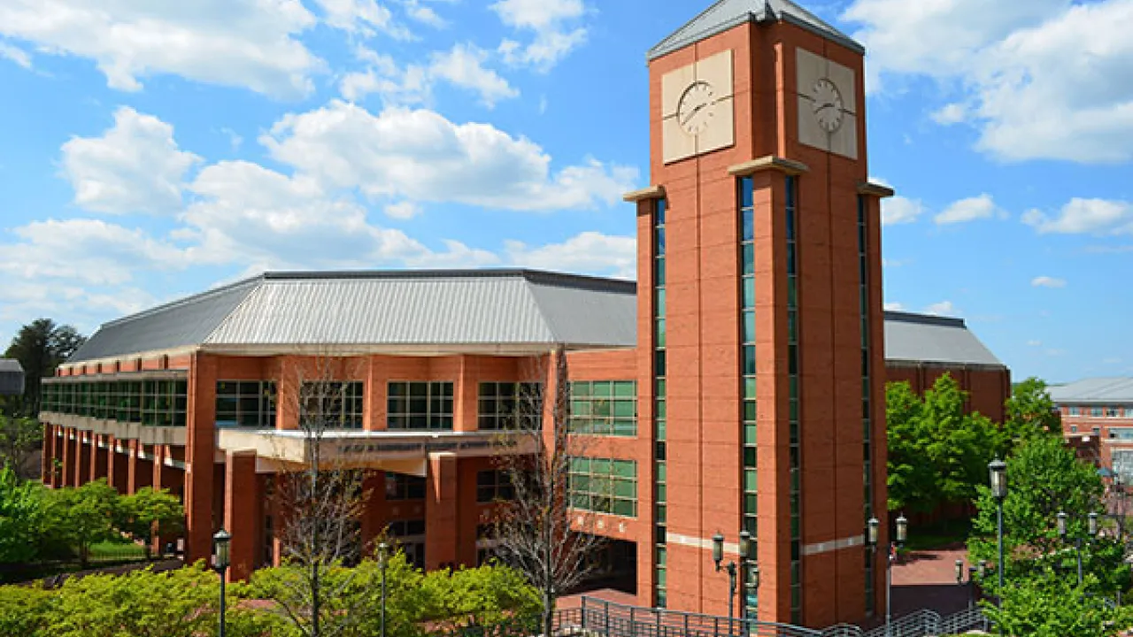 Large sports facility with clocktower attached